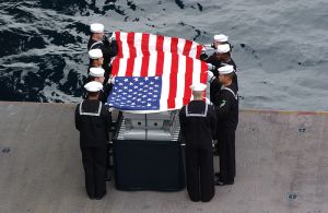 Pallbearers for Cdr. Robert J. Sanderson (Ret.) conduct a burial at sea ceremony in 2004. Photo courtesy of the U.S. Navy.