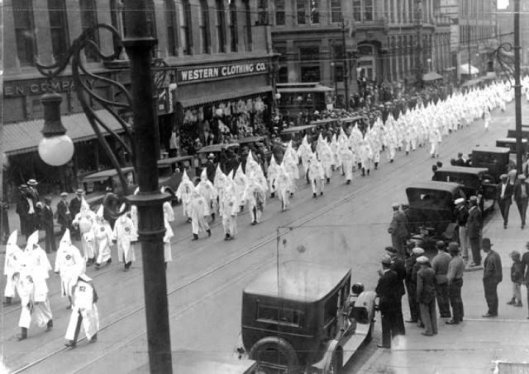 The Klan marches down Denver's Larimer Street on May 31, 1926. Photo source: The Denver Public Library Western History Collection. 